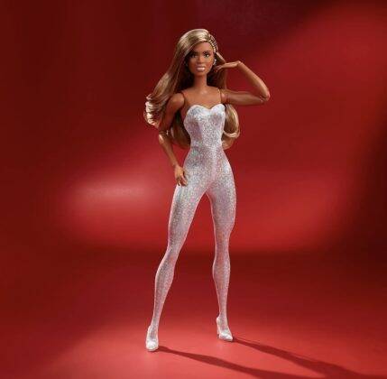 “She wears an original creation featuring a deep red tulle gown gracefully draped over a dazzling, silver metallic bodysuit." (Photo: Mattel release)