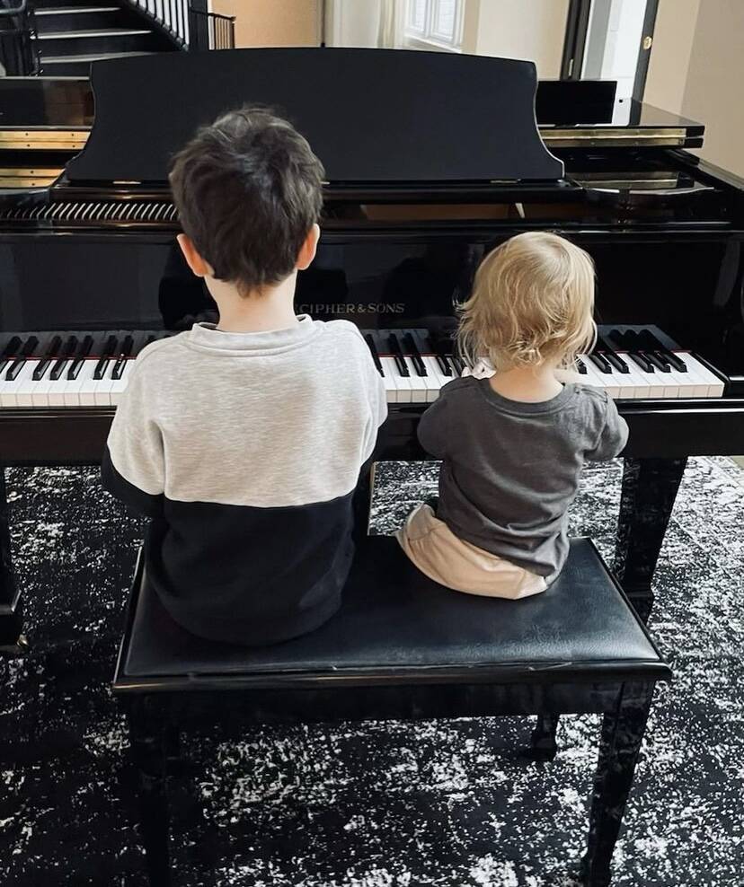 In the image shared on Instagram, Silas, 7, and Phineas, 1, are seen sitting side by side at a piano. (Photo: Instagram release)