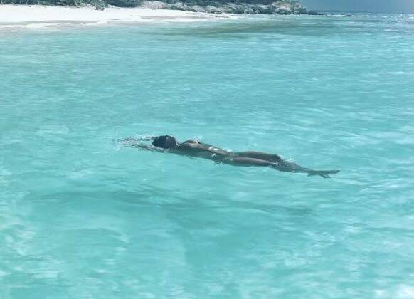 In one photo, the actress appears walking on a beautiful beach, and in another, floating in crystal blue water. (Photo: Instagram release)