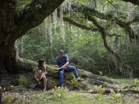 She learns to read and write from her friend Tate Walker and falls in love with him, but is left behind once again when he leaves for college. (Photo: Sony Picturres release)