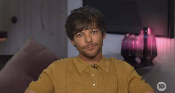 Tomlinson was visibly uncomfortable when presenters Carrie Bickmore and Peter Heliar began reminiscing about his time in One Direction. (Photo: Youtube/The Project release)